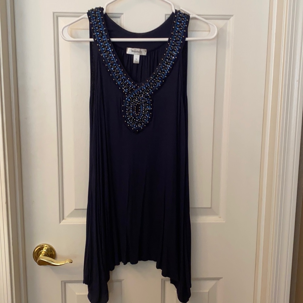 Sleeveless, navy beaded top. Very flattering!